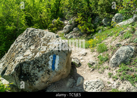 The entrance to the womb cave alos known as Utroba cave near Kardzhali city in Rhodope mountain in Bulgaria Stock Photo