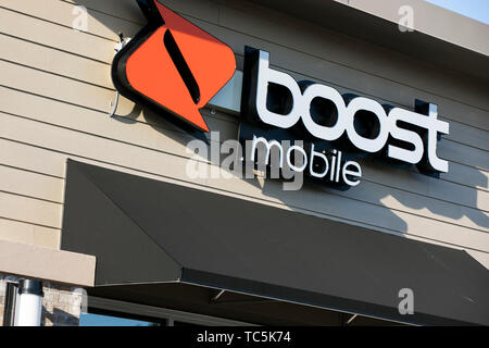 A logo sign outside of a Boost Mobile retail store location in Martinsburg, West Virginia on June 4, 2019. Stock Photo