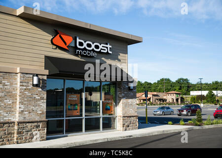 A logo sign outside of a Boost Mobile retail store location in Martinsburg, West Virginia on June 4, 2019. Stock Photo