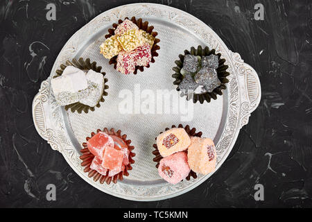 Set of various Turkish delight in bowl on metal tray Stock Photo