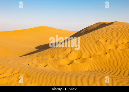 Sand dunes at sunset Stock Photo
