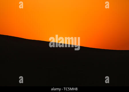 Red Sunset in the Desert Stock Photo