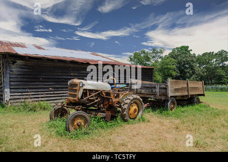 Old Tractor by Barn Stock Photo