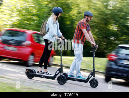 Herne, Germany. 05th June, 2019. Emina (l) and Tobi make a test drive with the E-Scooter from Circ (so far Flash). In Herne, citizens can now drive through the city on 50 electric scooters. Credit: Roland Weihrauch/dpa/Alamy Live News Stock Photo