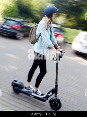 Herne, Germany. 05th June, 2019. Emina makes a test drive with the E-Scooter of Circ (so far Flash). In Herne, citizens can now drive through the city on 50 electric scooters. Credit: Roland Weihrauch/dpa/Alamy Live News Stock Photo