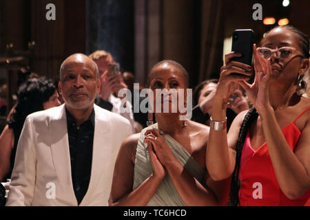 New York, New York, USA. 4th June, 2019. (L-R) Visual Artist Radicliffe Bailey, Chef Leslie Parks Bailey and Author Liani Madhubuti watch as Jamel Shabazz makes his epic tribute to the 20th Anniversary of Gordon Parks' Great Day in Hip Hop during the 2019 Gordon Parks Foundation Awards Dinner and Auction Inside celebrating the Arts & Social Justice held at Cipriani 42nd Street on June 4, 2019 in New York City. Credit: Mpi43/Media Punch/Alamy Live News Stock Photo