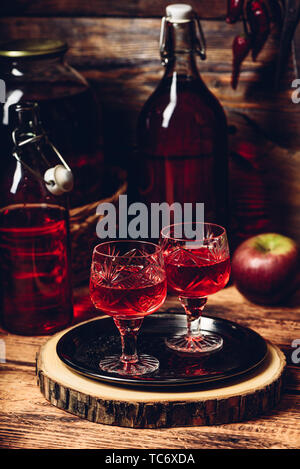 Two glasses of red homemade wine on tray Stock Photo