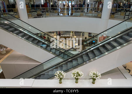 Escalators in a shopping mall in the  El Paseo shopping district in Palm Desert, California, USA. Stock Photo