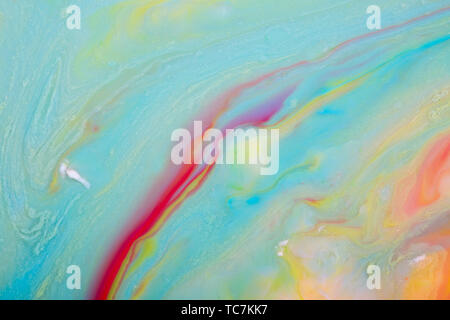 Colored propylene pigments, flowing abstract background Stock Photo