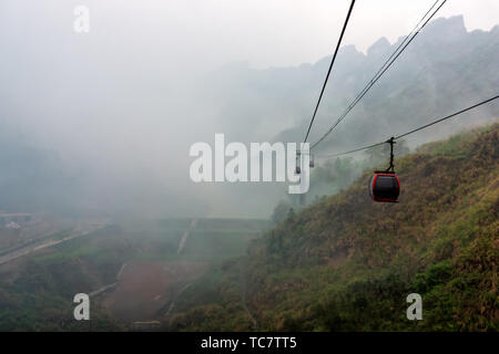 Cable way vanishing in mist in Tianmen Mountain, Zhangjiajie, Hunan, China Stock Photo