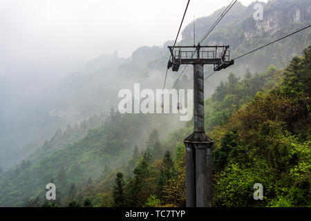 Cable way vanishing in mist in Tianmen Mountain, Zhangjiajie, Hunan, China Stock Photo