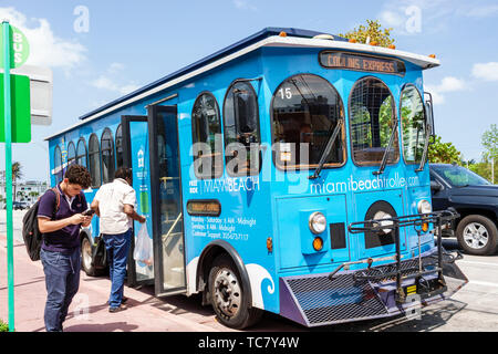 Miami Beach Florida,Normandy Isle,Collins Express free trolley bus Hispanic man men male,passenger riders boarding,FL190430077 Stock Photo