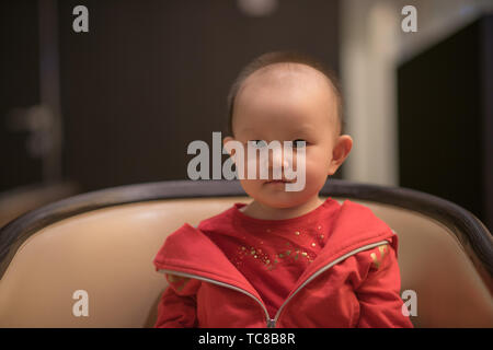 Nine-month-old toddler takes photo on cruise ship trip Stock Photo