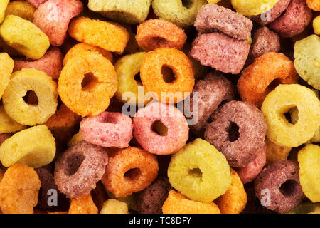 Close up on delicious fruit cereal loops flavorful, funny addition to kids breakfast. Stock Photo