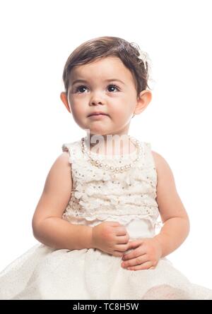 Vertical portrait of an 18 month old little girl having great fun being ...