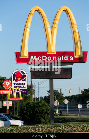 McDonald's, Taco Bell and Popeye's fast food restaurant location signs in Falling Waters, West Virginia on June 4, 2019. Stock Photo