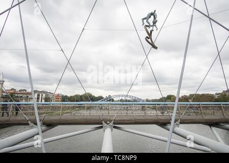 KRAKOW POLAND ON SEPTEMBER 25, 2018: Krakow's Father Bernatek footbridge and acrobatic figures by Polish artist Jerzy Jotki Kedziora.