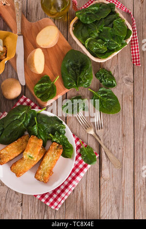 Potato croquettes with spinach and mozzarella. Stock Photo