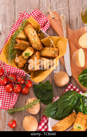 Potato croquettes with spinach and mozzarella. Stock Photo