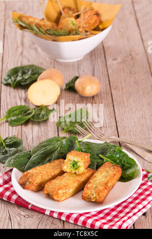 Potato croquettes with spinach and mozzarella. Stock Photo