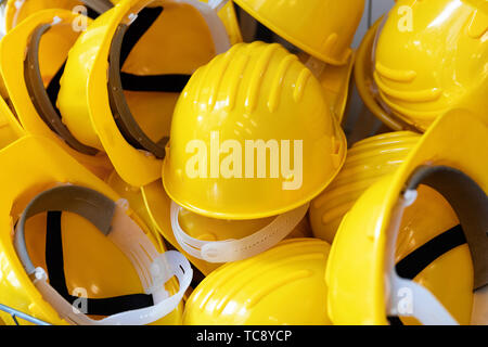 construction industry - group of yellow safety helmets Stock Photo