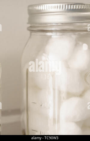 A glass jar of cotton balls in a doctor’s office Stock Photo - Alamy
