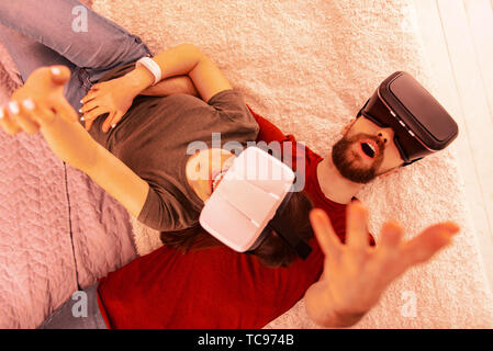 Sweet guy and girl having fun together at home Stock Photo