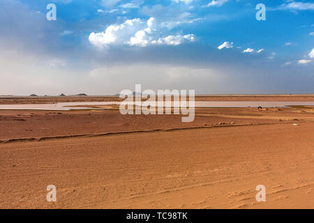 A desert landscape with a temporary pond after rainfall Stock Photo