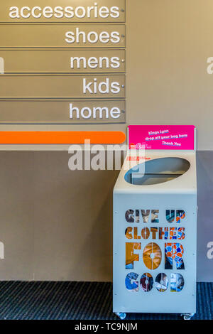 A Cancer Research clothes bank in a branch of TK Maxx invites people to Give Up Clothes For Good. Stock Photo