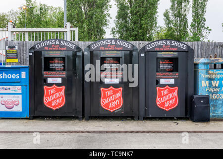 Salvation Army Clothing & Shoe collection points in a Tesco's car park. Stock Photo