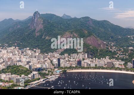 Rio de Janeiro, Brazil - December 21, 2012: Aerial view of Rio de Janeiro from the Sugarloaf Mountain. Statue of Christ the Redeemer in the