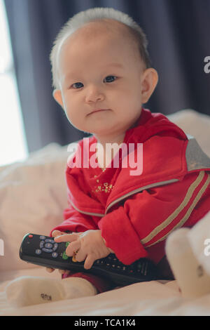 Nine-month-old toddler takes photo on cruise ship trip Stock Photo