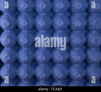 empty blue protective tray for raw chicken eggs with cells, full frame, close up Stock Photo