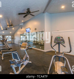 Interior Of A Spacious Fitness Gym With Various Exercise Equipment