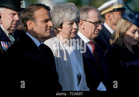 Prime Minister Theresa May, French President Emmanuel Macron (left) and Philip May (right) at the Inauguration of the British Normandy Memorial site in Ver-sur-Mer, France, during commemorations for the 75th anniversary of the D-Day landings. Stock Photo