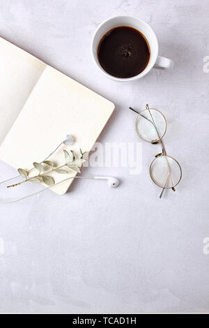 Coffee glasses and books on the desk. Stock Photo