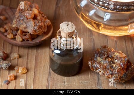 A bottle of myrrh essential oil with resin Stock Photo - Alamy