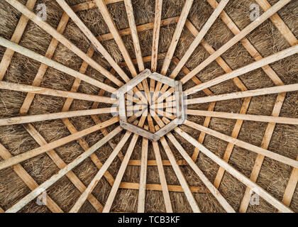 Hexagonal wood frame and thatched roof Stock Photo