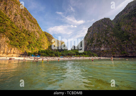 Crowd of tourists relax on the Maya beach on Ko Phi Phi Le island in Thailand Stock Photo