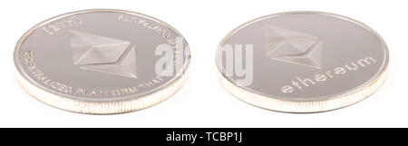 Golden ethereum isolated on white background. Front and back sides are shown. High resolution photo. With clipping path. Full depth of field. Stock Photo