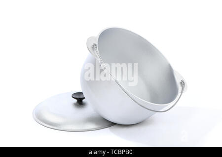 Cast-iron cauldron with cover for camping isolated on white background. High resolution photo. Full depth of field. Stock Photo