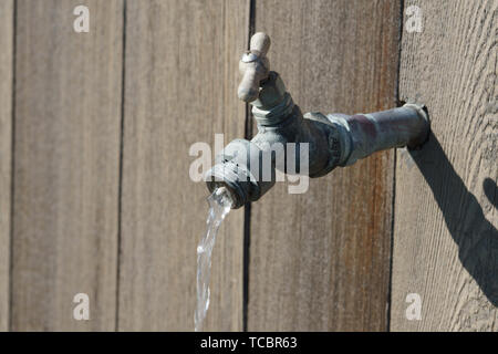 water out of old water spigot Stock Photo