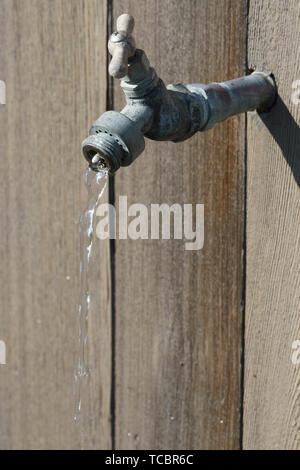 water out of old water spigot Stock Photo