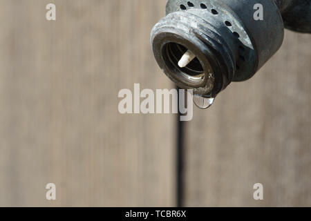 water out of old water spigot Stock Photo