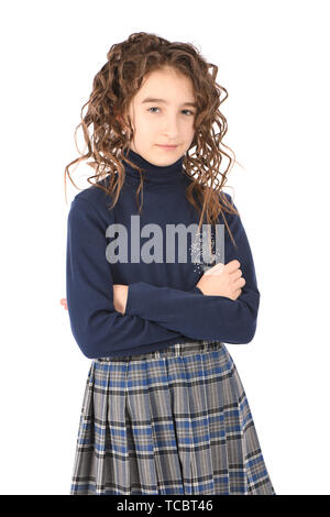 Portrait of adorable smiling girl child schoolgirl with curl hair standing isolated on a white background Stock Photo