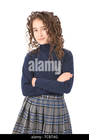 Portrait of adorable smiling girl child schoolgirl with curl hair standing isolated on a white background Stock Photo