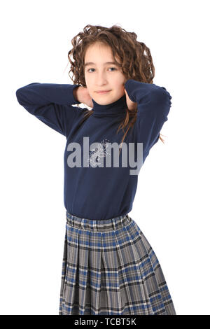 Portrait of adorable smiling girl child schoolgirl with curl hair standing isolated on a white background Stock Photo