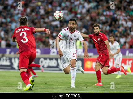 Tehran, Iran. 6th June, 2019. Omid Ebrahimi (C) of Iran competes during a friendly football match between Iran and Syria at Azadi Stadium in Tehran, Iran, June 6, 2019. Iran won 5-0. Credit: Ahmad Halabisaz/Xinhua/Alamy Live News Stock Photo