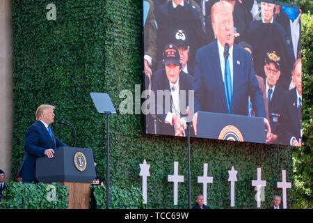 Colleville Sur Mer, France. 06th June, 2019. U.S. President Donald Trump delivers remarks during the commemoration ceremony marking the 75th D-Day Anniversary at the Normandy American Cemetery and Memorial June 6, 2019 in Colleville-sur-Mer, France. Thousands have converged on Normandy to commemorate the 75th anniversary of Operation Overlord, the WWII Allied invasion commonly known as D-Day. Credit: Planetpix/Alamy Live News