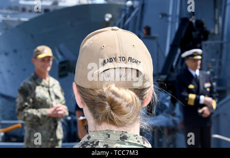 Kiel, Germany. 07th June, 2019. With 'Ready to Fight' printed on her cap, a US Navy female soldier stands at the start of the Baltic Operations (BALTOPS) manoeuvre in the naval port. Warships from 18 nations take part in the manoeuvre on the Baltic Sea starting on 08.06.2019 Credit: Carsten Rehder/dpa/Alamy Live News Stock Photo